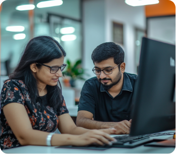 Manager at Clixlogix helping the team member with her work